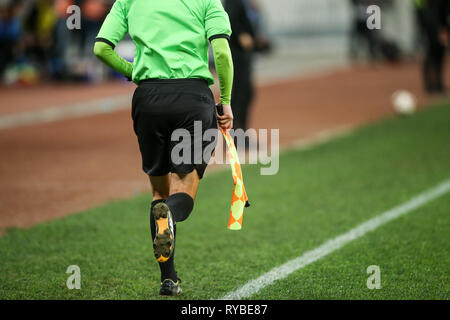 Details einer linienrichter Schiedsrichter bei einem Fußball-Spiel Stockfoto