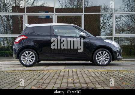 2014 Suzuki Swift SZ-L heiße Luke Compact Car Stockfoto