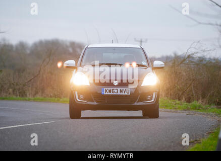 2014 Suzuki Swift SZ-L heiße Luke Compact Car Stockfoto