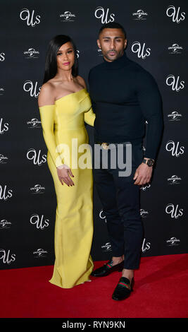 Sian Gabbidon ands Clint Gordon die Teilnahme an einem exklusiven Screening von uns neue Herr Peele's Film, Picturehouse Zentrale der Shaftesbury Avenue, London. Stockfoto