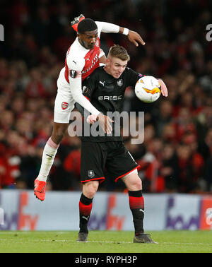 London, Großbritannien. 14 Mär, 2019. Ainsley Maitland-Niles (L) von Arsenal Mias mit Benjamin Bourigeaud Rennes in der Europa League Runde 16 zweite Bein Spiel zwischen Arsenal und Rennes im Emirates Stadium in London, Großbritannien, am 14. März 2019. Arsenal besiegte Rennes mit 3-0 am Donnerstag (4-3 am Aggregat) und war für die Europa League qualifiziert - Finale. Quelle: Matthew Impey/Xinhua/Alamy leben Nachrichten Stockfoto