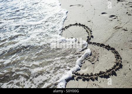 Herz am Strand Stockfoto