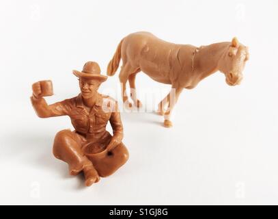 Kunststoff-Figuren Cowboy und Pferd. Stockfoto