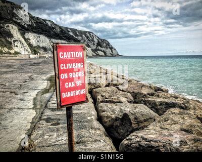 Vorsicht Klettern am Felsen können gefährlich sein. Stockfoto