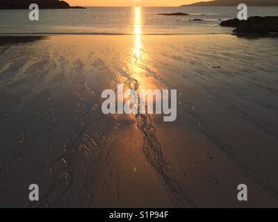 Achmelvich Beach, an der Westküste von Schottland bei Sonnenuntergang Stockfoto
