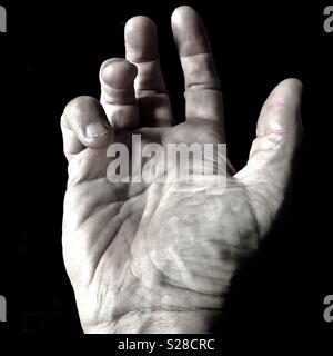 Die Hand mit der Handfläche nach oben Schließen Stockfoto