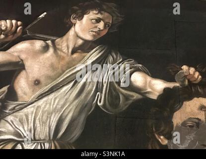 Chalk Art Replik von David mit dem Kopf von Goliath von CARVAGGIO . Ich bin spät in der Nacht auf diesen Straßenkünstler gestoßen, der dieses Kreidestück für die Zuschauer der folgenden Tage schuf. Stockfoto