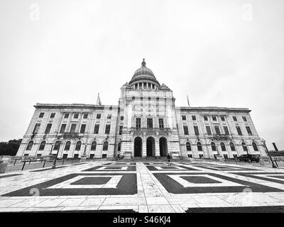 Exterior of Rhode Island State House in Providence, Rhode Island, USA. Entrance into the building. Neoclassical architecture designed by McKim, Mead, and White. Black and white filter. Stock Photo