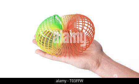 Die Hände gestreckt Regenbogen Spirale. Spielzeug aus der Kindheit. Stockfoto