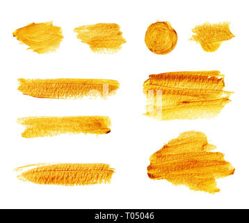 Satz von Hand gold glänzenden Pinselstriche und Flecken auf weißem Hintergrund gezeichnet Stockfoto