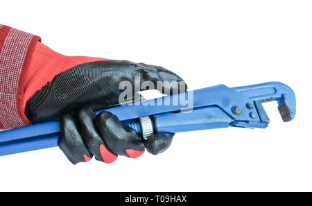 Gas verstellbarer Schraubenschlüssel in der Hand eines Mannes in einem roten Handschuh arbeiten. Schlüsseldienst Werkzeug. Stockfoto
