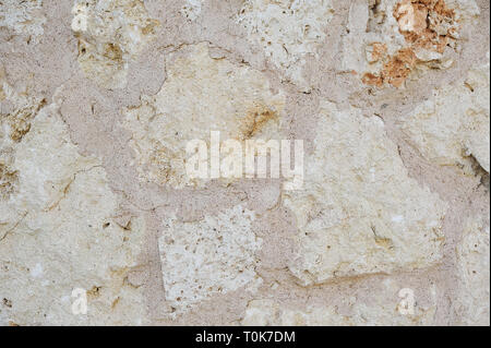 Struktur Wand Fragment mit Kratzern und Rissen Stein Hintergrund. Stockfoto