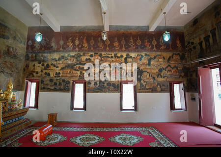 Uthai Thani, Thailand - Januar 12, 2019: Der berühmte schöne Buddhismus Wandgemälde im Wat Ubosatharam in Uthai Thani Thailand. Stockfoto