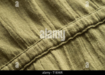 Olivgrün gerillt Stoff Kleid detail Stockfoto