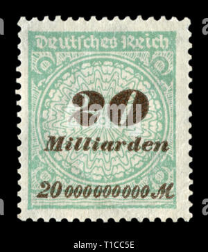 Deutsche historische Stempel: Grüne Briefmarke mit Aufdruck mit einem Nominalwert von 20 Milliarden Mark, Hyperinflation, die Wirtschaftskrise in Deutschland Stockfoto