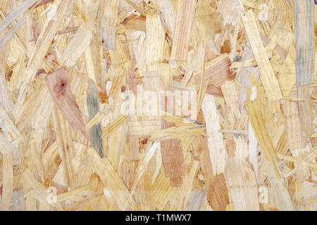 Nahaufnahme eines recycelt komprimierte Hellbraun Holzhackschnitzel board strukturierten Hintergrund. Abstrakte Textur Hintergrund. Stockfoto