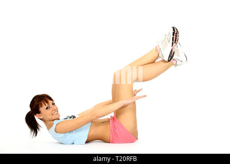 Eine junge Frau im Sport. Gegen einen weißen Hintergrund. Stockfoto