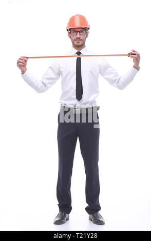 Im vollen Wachstum. Der junge Architekt mit gelbem Maßband Stockfoto