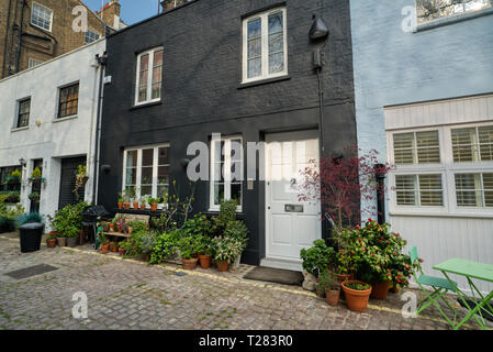 Connaught Dorf - Einzelhandel Luxus Hyde Park Estate Viertel an einem sonnigen Tag in London, Vereinigtes Königreich Stockfoto