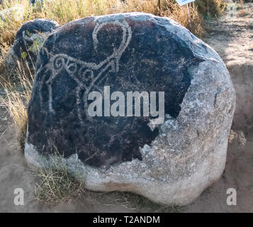 Rock Malerei aka petroglypgs in der Feld-, Cholpon-Ata, Issyk-kul, Kirgisistan Stockfoto