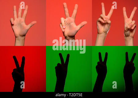 Ein Satz von Zeichen auf die Finger der Hände, die Silhouetten auf einem isolierten grünen Hintergrund 2019 dargestellt Stockfoto