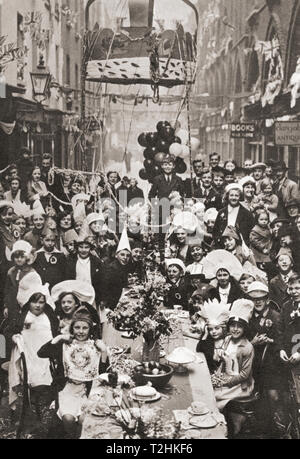 Ein typisches Londoner Straße Tea Party. Kinder feiern der Krönung von George VI und Queen Elizabeth in 1937. Von der Krönung in Bilder, veröffentlicht 1937. Stockfoto