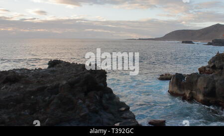 Atardecer en Playa de Gran Canaria. Sonnenuntergang in Gran Canaria Strand. Stockfoto