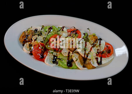 Heirloom Tomaten und Mozzarella Salat Stockfoto