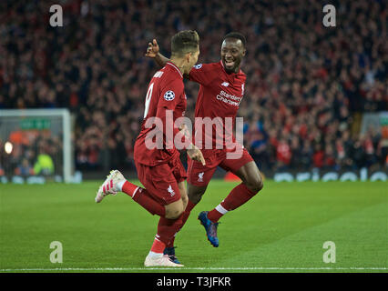 Liverpool. 10 Apr, 2019. Liverpools Naby Keita (R) feiert mit Mannschaftskamerad Roberto Firmino während der UEFA Champions League Viertelfinale Hinspiel Match zwischen dem FC Liverpool und dem FC Porto an der Anfield in Liverpool, Großbritannien am 9. April 2019. Liverpool gewann 2-0. Quelle: Xinhua/Alamy leben Nachrichten Stockfoto