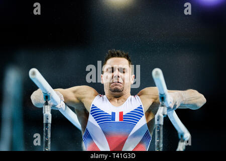 Paul Degouy aus Frankreich in Aktion auf der parallelen Balken während der Männer vielseitige Final des 8. Europäischen Meisterschaften im Turnen gesehen. (Tag 3) Stockfoto