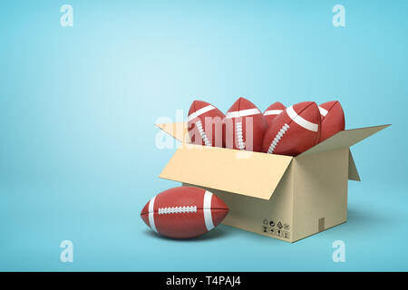 3D-Rendering von Kugeln für American Football im Inneren im Karton auf blauem Hintergrund. Stockfoto