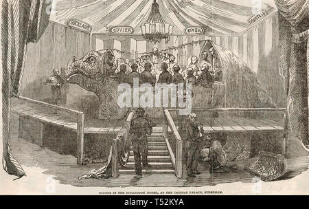 BEJAMIN WATERHOUSE HAWKINS (1807-1894), englischer Bildhauer und einem Abendessen am 31. Dezember 1853 innerhalb der Formpresse hosted er verwendet ein Modell Iguanodon am Crystal Palace zu machen. Stockfoto