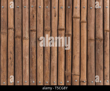 Braunen Hintergrund aus Bambus stammt, Holzzaun. Stockfoto