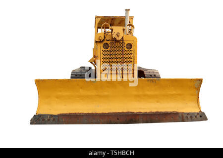 Alte gelbe Rusty crawler Traktor auf dem Feld. Alte Raupenschlepper auf weißem Hintergrund. Hochauflösende Bilder Galerie. Stockfoto