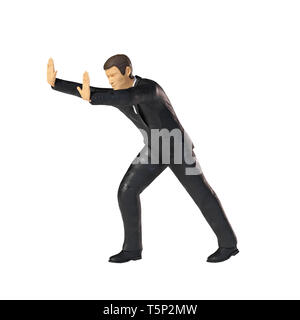 Spielzeug miniatur Geschäftsmann drücken, Business figurine Konzept auf weißem Hintergrund Stockfoto