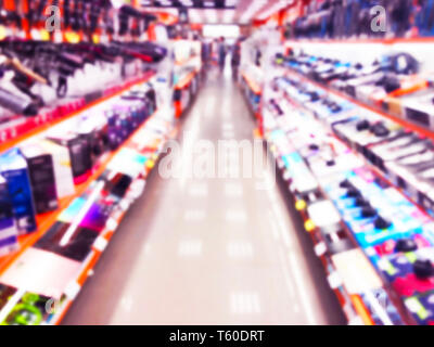 Abstract blur Hintergrund mit Mobile Store Boutique in der Shopping Mall. Elektronische Kaufhaus Interieur mit Bokeh leicht verschwommenen Hintergrund. Unscharf Stockfoto