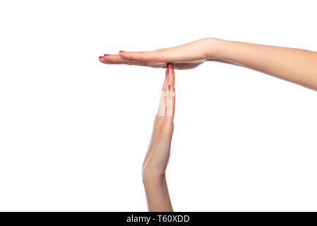 Weibliche Hände zeigen ein Timeout oder Pause Zeichen auf weißem Hintergrund. Stockfoto