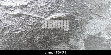 Alte, gesprungene Wand mit silberfarbe Textur Hintergrund Stockfoto