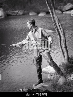 1920er Jahre 1930er Jahre jungen Mann mittleren Alters SPORTSMAN FLIEGENFISCHEN VON FRÜHLING RIVER BANK ABER STRAPAZIERFÄHIGES GUMMI WADERS-a2786HAR 001 HARS KOPIE RAUM VOLLER LÄNGE KÖRPERLICHE FITNESS PERSONEN MÄNNER HAKEN GELASSENHEIT SPIRITUALITÄT VERTRAUEN B&W FANG FREIHEIT SKILL AKTIVITÄT AMUSEMENT GLÜCK KÖRPERLICHE WELLNESS ABENTEUER HOBBY FREIZEIT STÄRKE STRATEGIE INTERESSE WAHL HOBBYS WISSEN LEIDENSCHAFT FREIZEIT ZEITVERTREIB STOLZ HASPEL VERGNÜGEN KONZEPTIONELLE ABER ENTKOMMEN FLEXIBILITÄT MUSKELN STILVOLLE WADERS MITTLEREN ALTER SPORTLER Mitte - Mitte - erwachsenen Mann ENTSPANNUNG FRÜHLING WILDLIFE AMATEUR SCHWARZ UND WEISS KAUKASISCHEN ETHNIE Stockfoto