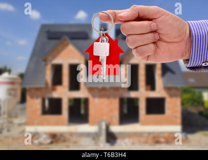 Schlüssel in der Hand für neues Haus und Immobilien Stockfoto