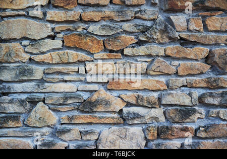 Naturstein Hintergrund oder Textur. Verschiedene Steine und Beton. Stockfoto