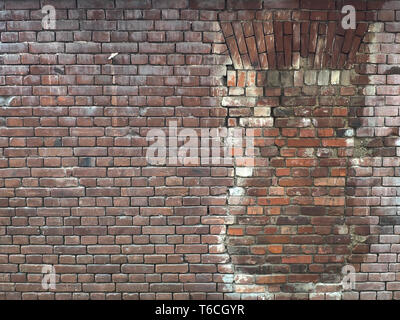 Old Red Brick Wall mit einer Fensterscheibe, die von Steinen der gleichen Typs wiederhergestellt, freier Platz für Text Stockfoto