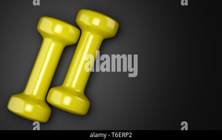 Gelbe Kurzhanteln auf schwarzem Hintergrund Stockfoto