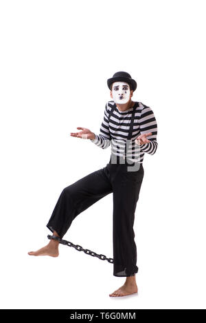 Mime mit seinen Füßen angekettet isoliert auf weißem Stockfoto