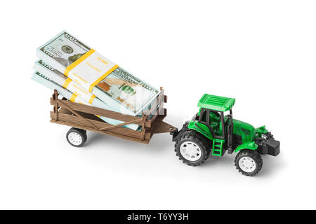 Spielzeug Traktor mit Geld Stockfoto