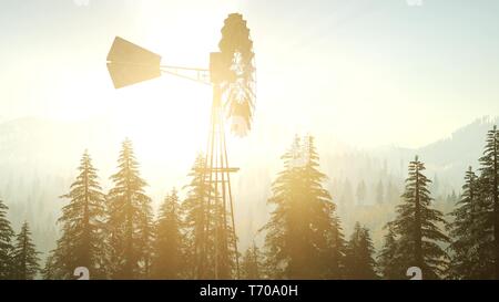 Typische alte Windmühle Turbine im Wald bei Sonnenuntergang Stockfoto