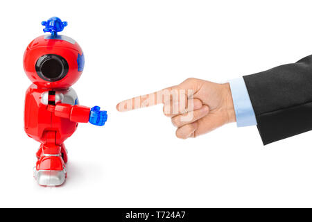 Spielzeug Roboter und Hand Stockfoto