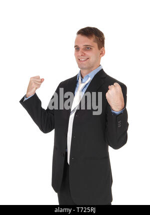 Glücklich der Mann, der mit den Fäusten angehoben Stockfoto