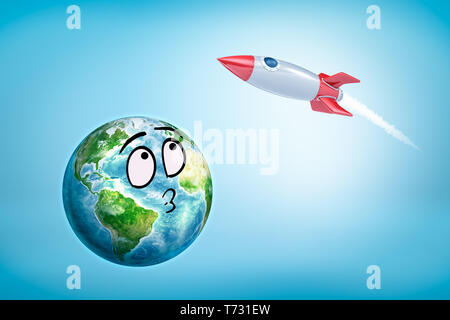 3D-Rendering von smiley Cartoon konfrontiert Earth Globus und rot silber Rakete auf blauem Hintergrund Stockfoto