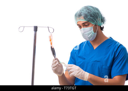 Junger Arzt im Infusion Konzept auf Weiß isoliert Stockfoto